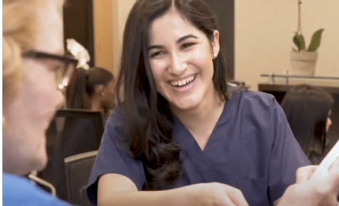 friendly dental staff gathering patient info