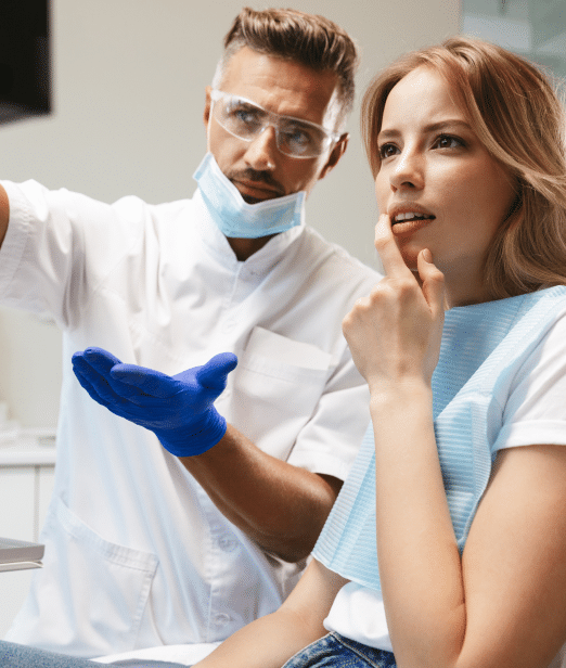 Periodontist and patient reviewing x-rays and treatment plan