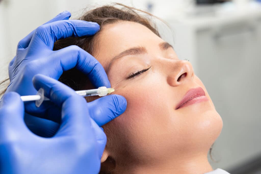 Relaxed, young patient getting botox.